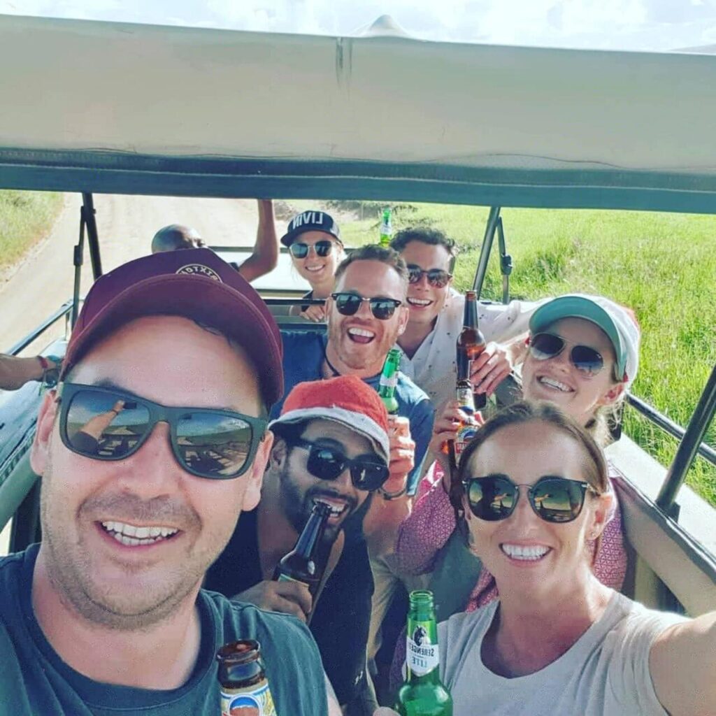 Group safari travelers at Ngorongoro Crater viewpoint in Tanzania.