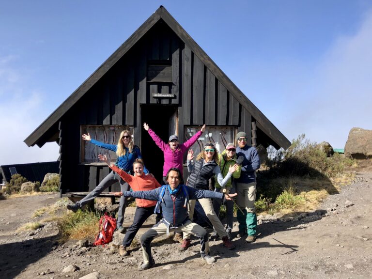 hikers at an alpine hut on Marangu route, Kilimanjaro