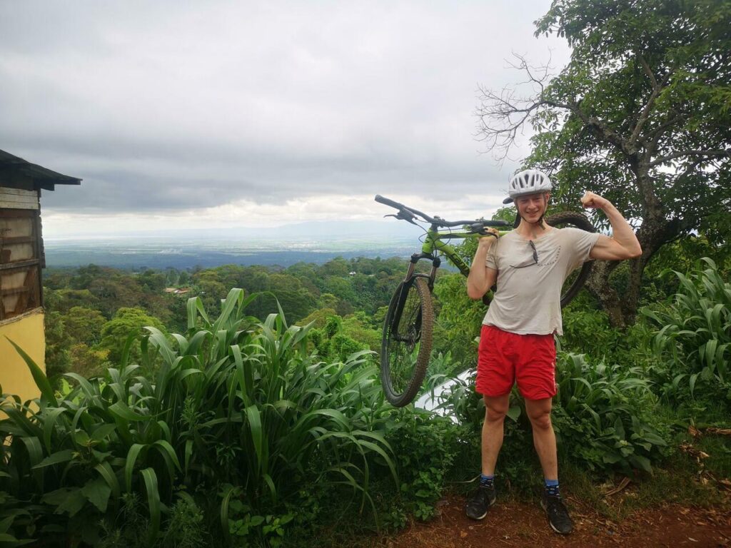 Tourist carrying Bicycle at Materuni view point in Moshi