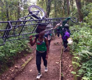 porter carrying stretcher on Kilimanjaro