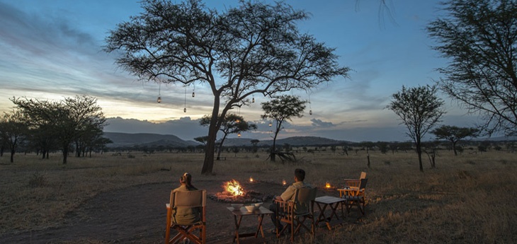 safari camp in serengeti during sunset