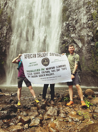 people infront of Materuni waterfalls