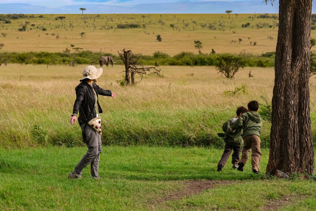 kids on tanzania safari running with their mom