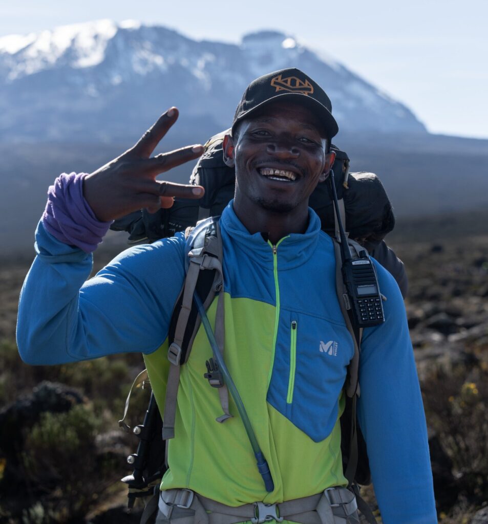 Kilimanjaro mountain guide posing for pics